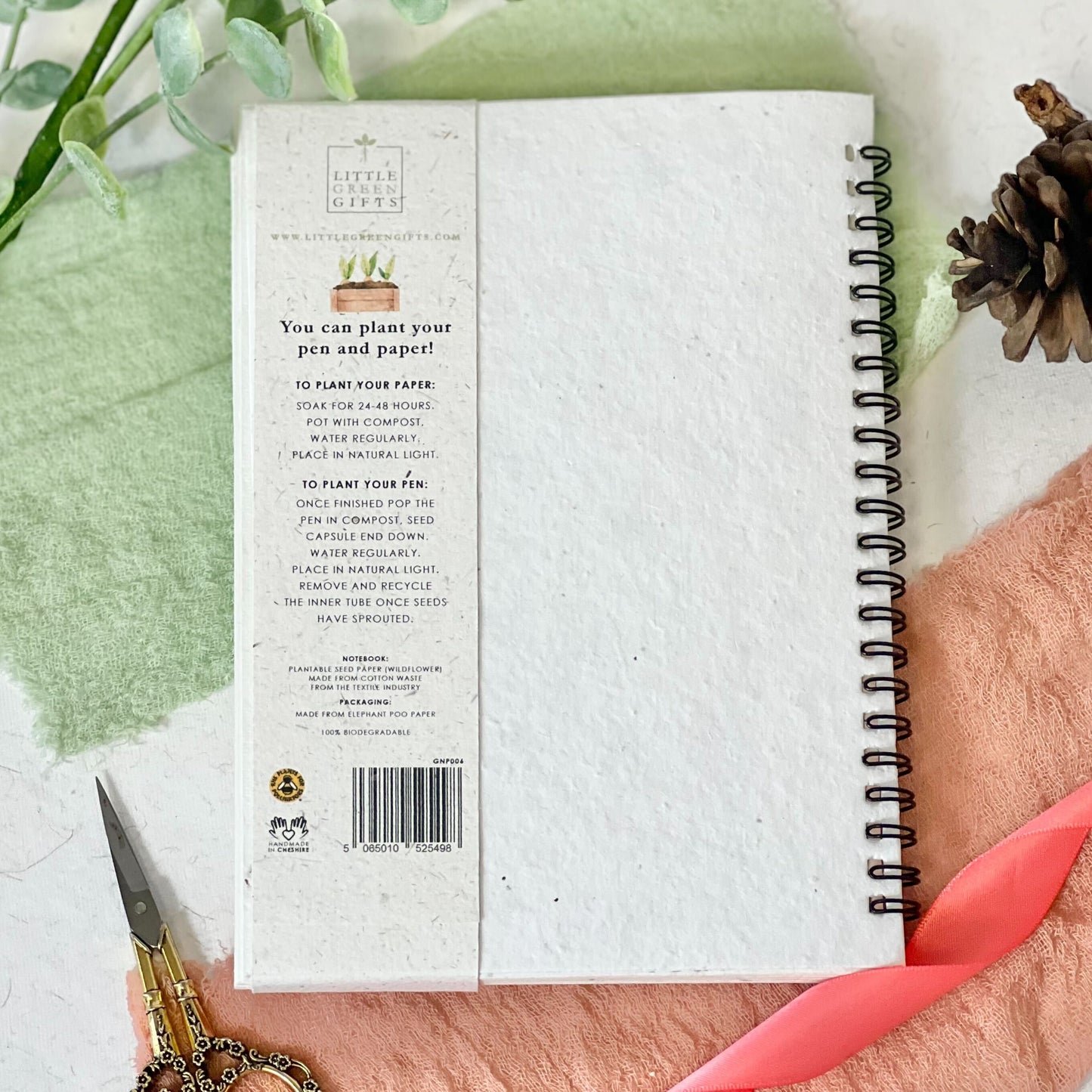 Eco-friendly notebook & pen set with a plantable seed paper cover featuring a floral gardening design.