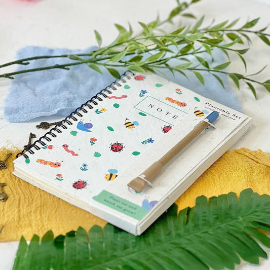 Eco-friendly notebook and plant-a-pen set with a fun, nature-inspired bug design